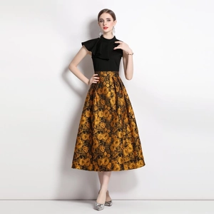 French vintage sleeveless dress featuring a black mock neck bodice and gold jacquard skirt