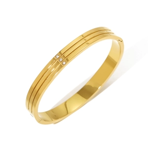 Gold stainless steel H-shaped bracelet with inlaid zircon stones on a white background