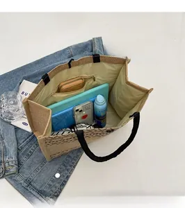 Spacious interior of jute tote bag showing capacity for tablet, umbrella and wallet