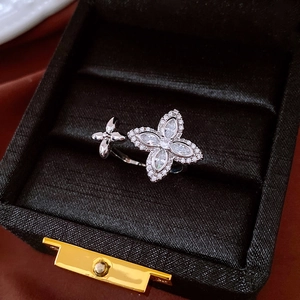 Macro detail of French zircon flower open ring with sparkling marquise stones