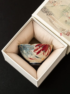 Detail shot of hand-painted koi fish ceramic tea cup in a premium vintage gift box