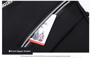 Detail of front small zipper pocket on black oxford chest bag showing card storage space