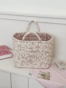 Detailed quilted corduroy organizer bag with pink peony floral patterns and soft handles
