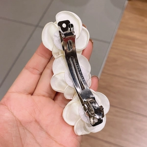 Elegant white camellia hair clip with silk petals and durable metal duckbill clip