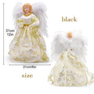 Detailed view of white angel tree topper featuring golden lace and real feather wings