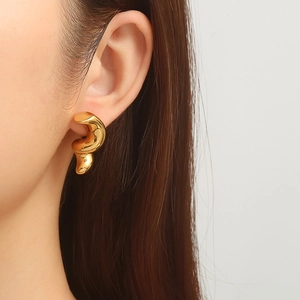Elegant 18K gold plated earrings with a unique sculptural twisted geometric design