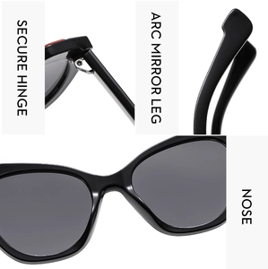 Detail view of black cat-eye frames featuring secure hinges and comfortable nose pads