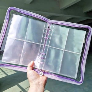 Close-up of purple glitter zipper binder with transparent four-grid jewelry storage pages