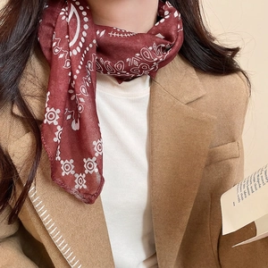 Elegant burgundy paisley silk scarf necklace for women styled with a winter wool coat