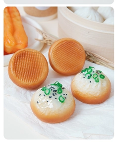 Macro shot of realistic PVC fried bun miniatures with sesame seeds and herbs detail