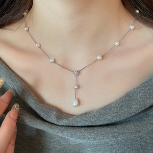 Elegant Y-shape necklace with white pearls, zircon star pendant, and waterdrop pearl drop