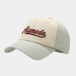 Detail of red Alameda embroidery on beige and light green cotton twill baseball cap