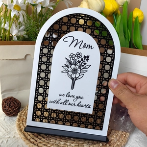 Detail of Mom gift plaque held by hand with floral design and loving message