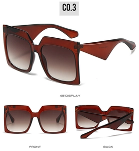 Detailed view of amber square sunglasses with gradient brown lenses and reinforced hinges