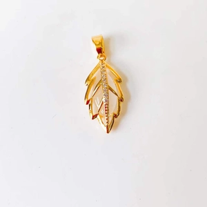 Close-up of a 18k gold leaf-shaped pendant with small transparent gemstones on white background