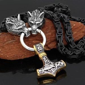Detail of Viking Thor Hammer pendant with wolf head rings on a black Byzantine chain
