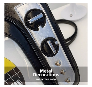 Detail of lychee pattern leather with silver hardware and heart-shaped metal rivets