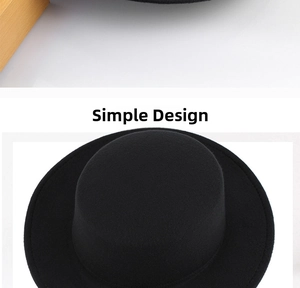Vertical top view of a black wool felt boater hat with a flat top and wide brim design