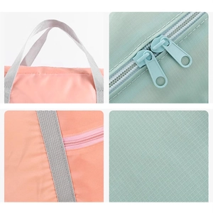 Large capacity oxford cloth travel storage bag with reinforced handles in pink and teal