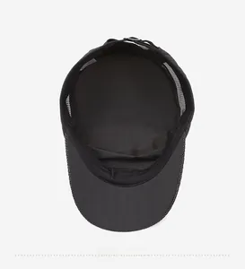 Interior view of black mesh flat top cap showing breathable fabric and inner sweatband