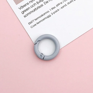 Close-up of 20mm matte grey spring ring hook for DIY jewelry and bag accessories