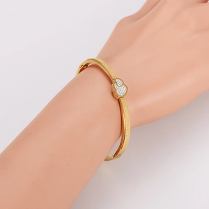 Elegant gold-plated stainless steel open bangle with frosted finish and double heart rhinestones