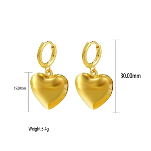 Detail view of gold shell heart earrings with measurements 30mm length and 3.4g weight