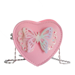 Pink heart-shaped girl's crossbody bag with butterfly detail and silver chain strap