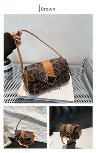 Detailed close-up of brown leopard print crossbody bag with golden geometric metal buckle