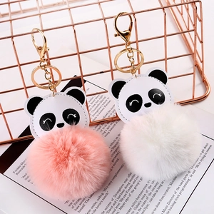 Cute panda plush ball keychain in pink and white with golden metal ring and leather detail