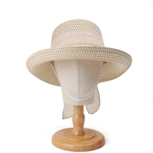 Detail of khaki straw sun hat featuring breathable mesh crown and white neck strap