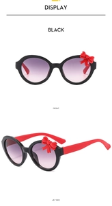 Front and 45-degree side views of black bowknot sunglasses for kids with purple lenses