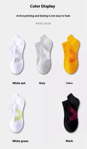 Flat lay display of five low-cut athletic socks in various colors on a neutral background