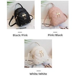 Three mini quilted backpacks in black pink and white with golden swan pendant detail