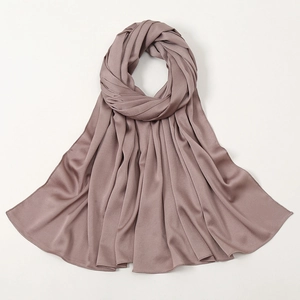 Elegant dusty pink silk-like satin hijab scarf with smooth texture and subtle glossy finish