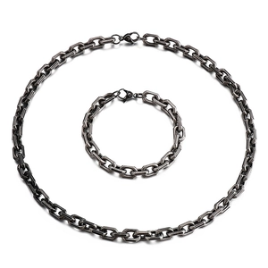 Vintage stainless steel jewelry set featuring chunky chain necklace and matching bracelet