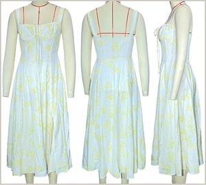 Detail view showing floral pattern, drawstring chest, and side slit of the white midi dress