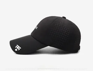 Detail of breathable laser-cut vents and white logo on black quick-dry baseball cap