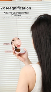 Pink portable makeup mirror showing 1X and 2X magnification for detailed beauty routines