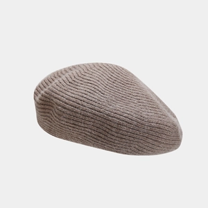 Detail shot of the taupe wool blend knit beret showing soft textured fiber and ribbing