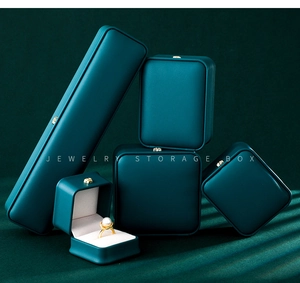 Premium dark green leather jewelry storage box collection showing necklace and ring cases