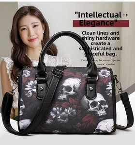 Close-up of skull and floral print on a black gothic Oxford fabric crossbody bag