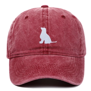 Detailed embroidery of a white dog silhouette on a vintage washed cotton baseball cap