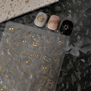3D embossed gold Halloween nail stickers with pumpkins, bats, and ghosts patterns
