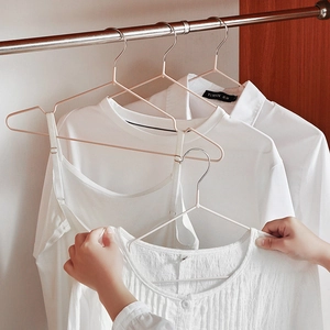 Non-slip dip-coated metal hangers with shoulder notches for slim clothing storage