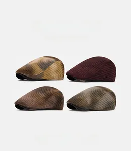 Close-up of four newsboy hats showing textured knit patterns and vintage colors