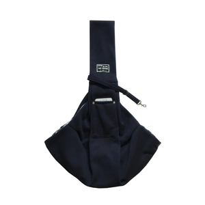 Detail of pet crossbody bag showing phone storage pocket and sturdy adjustable shoulder strap