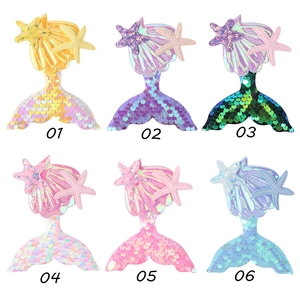 Detailed grid showing six colorful sequined mermaid tail hair clips with shells