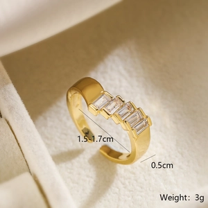 Detailed view of adjustable gold plated ring showing interior diameter and zircon width