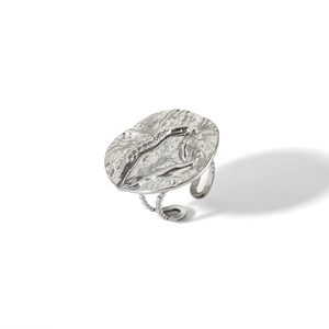 Detail of silver textured ring with unique hammered surface and adjustable open band